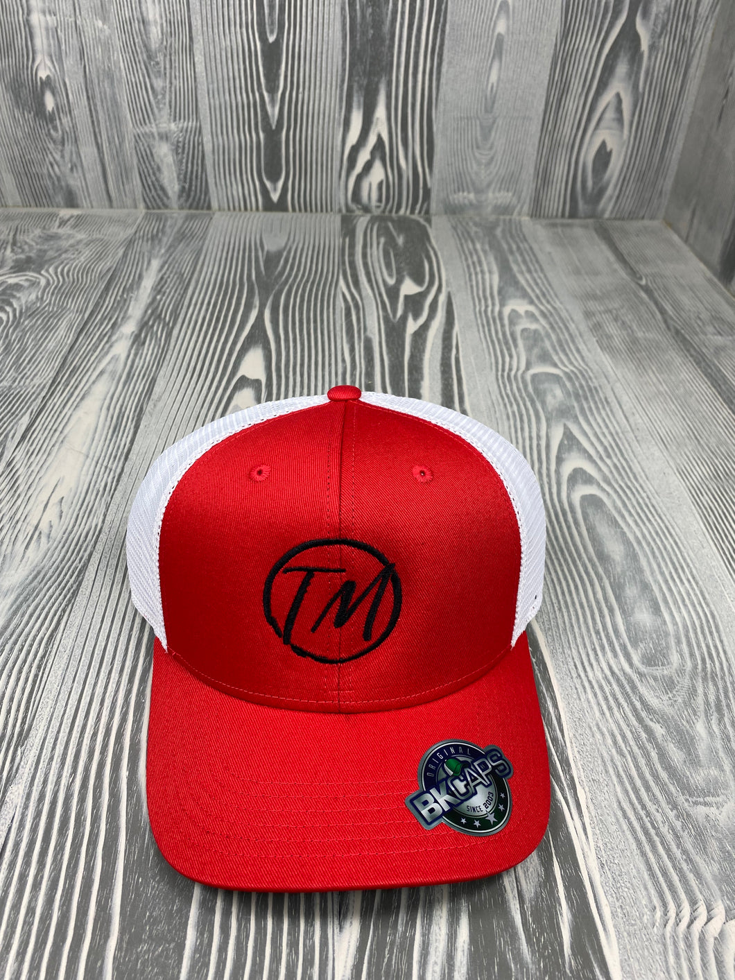 SNAPBACK RED HAT WITH TM LOGO